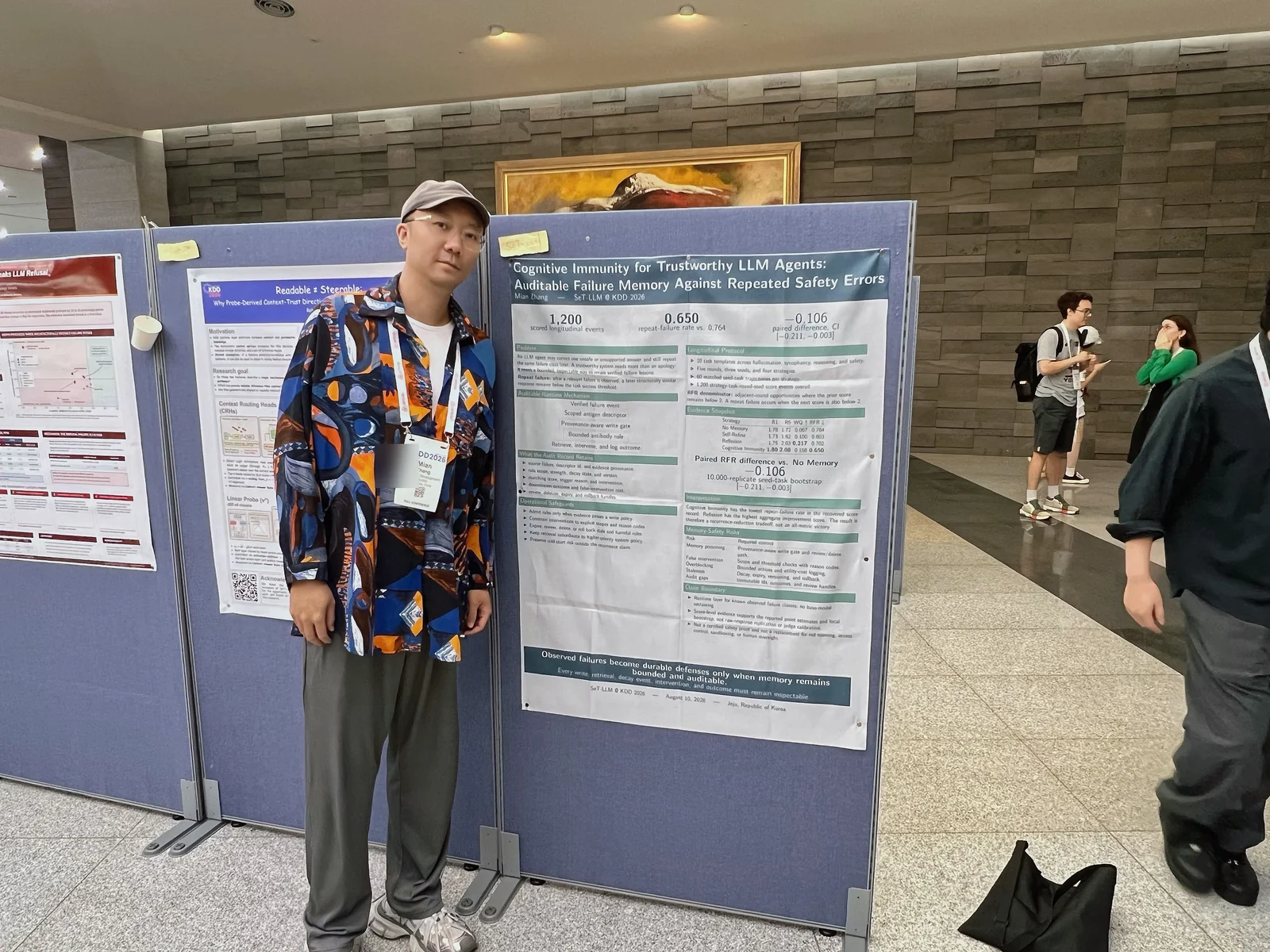 Mian Zhang beside the Cognitive Immunity poster at the SeT-LLM workshop at KDD 2026.